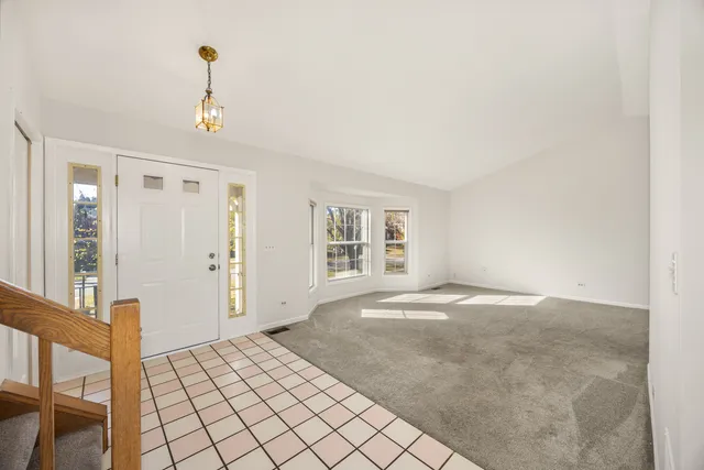 a view of an empty room and window