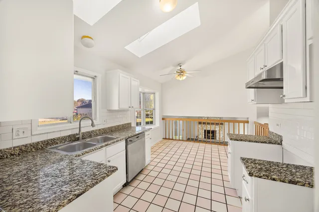 a bathroom with a sink a mirror and shower