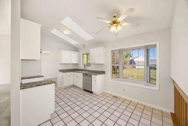 a kitchen with a cabinets and window