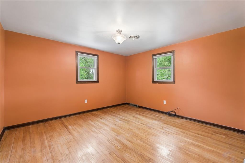 22 Buzzardtown Road Irwin, PA 15642 - Photo 22 of 44 wooden floor in an empty room with a window