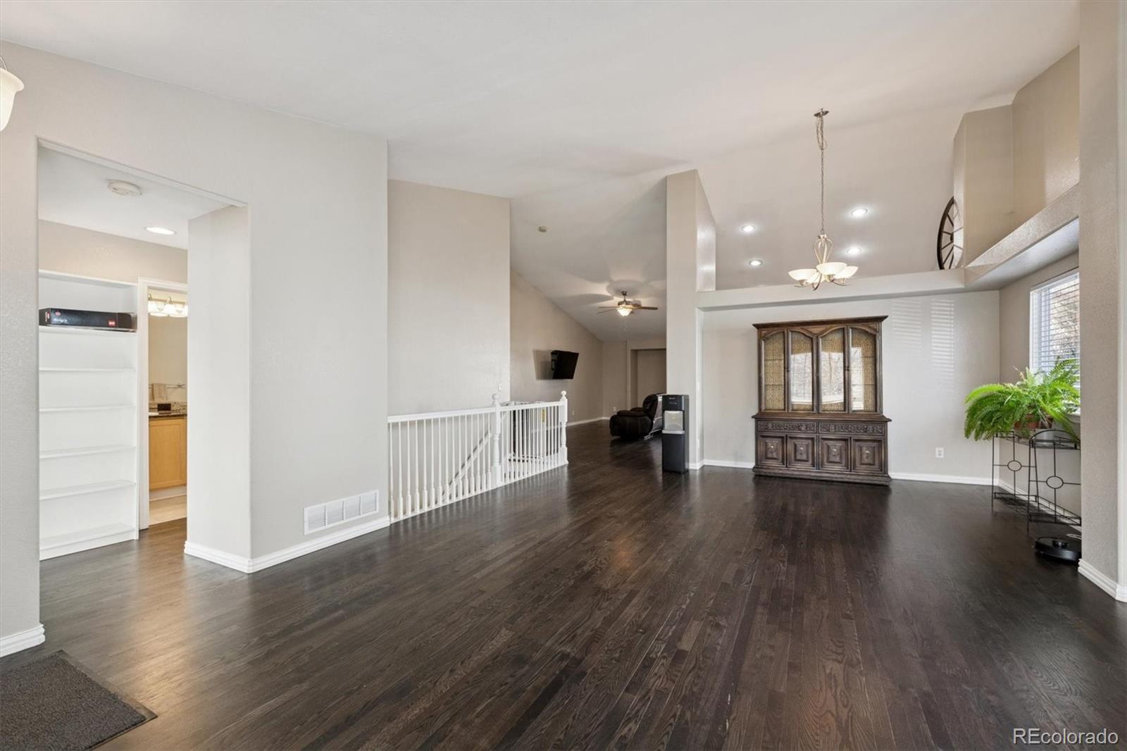 3431 Grove Street Brighton, CO 80601 - Photo 17 of 34 a living room with furniture and a wooden floor