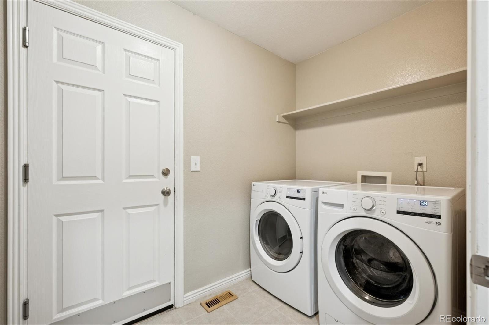 3431 Grove Street Brighton, CO 80601 - Photo 26 of 34 a utility room with dryer and washer