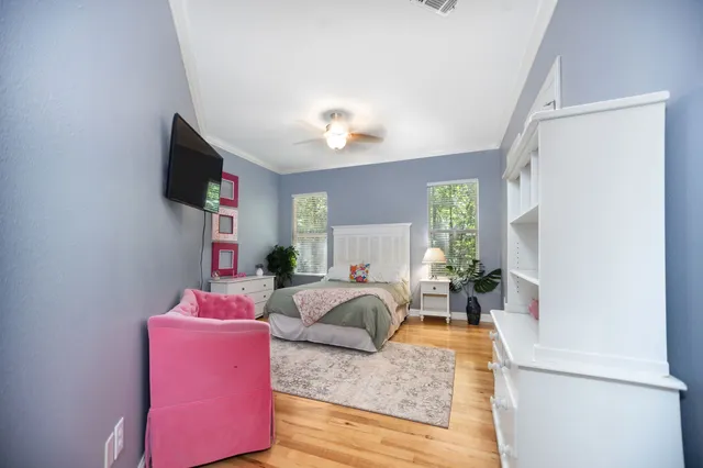 a bathroom with a sink a toilet a mirror and shower curtain