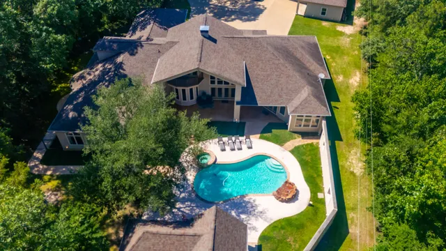 a view of swimming pool with sitting area