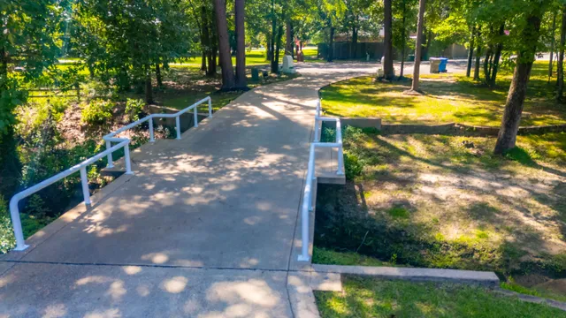 a dining room with furniture a chandelier and wooden floor