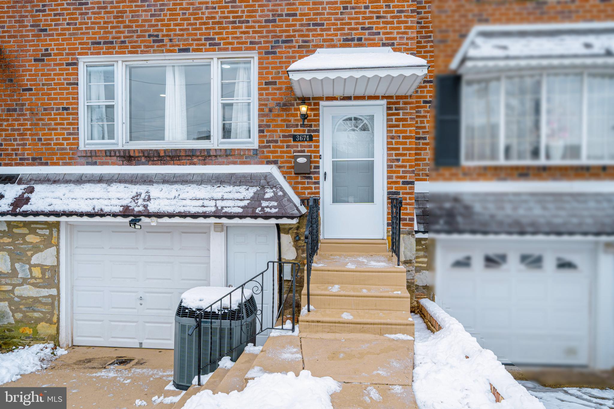 a front view of a house with stairs