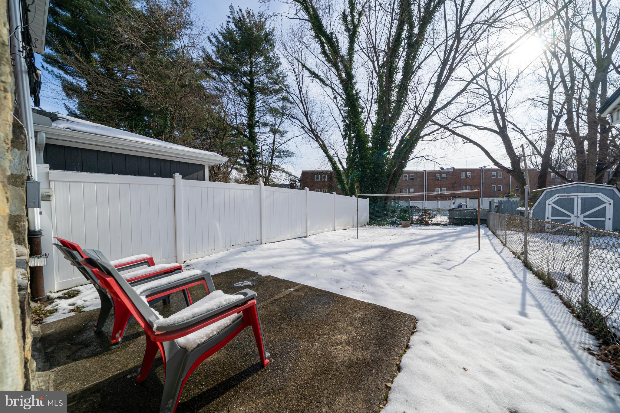 3674 Salina Road Philadelphia, PA 19154 - Photo 20 of 22 a backyard of a house with wooden fence and large trees