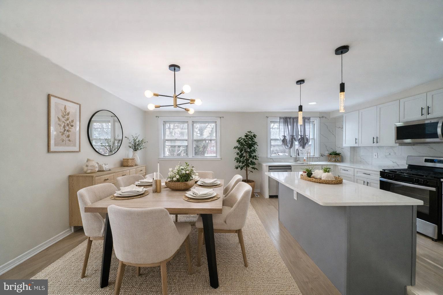 3674 Salina Road Philadelphia, PA 19154 - Photo 4 of 22 a kitchen with a dining table and chairs