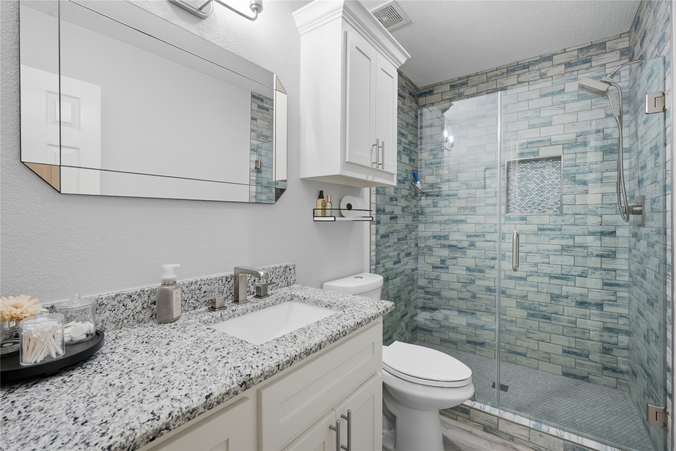615 Lilley Road Alvin, TX 77511 - Photo 22 of 42 Custom walk-in shower with glass surround in secondary bathroom.