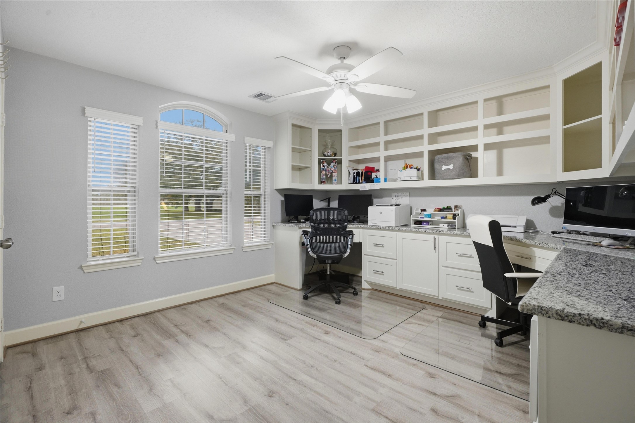 615 Lilley Road Alvin, TX 77511 - Photo 24 of 42 Secondary bedroom with custom desks (2 workstations), granite surface with above and below built-in shelving, drawers, and cabinets.