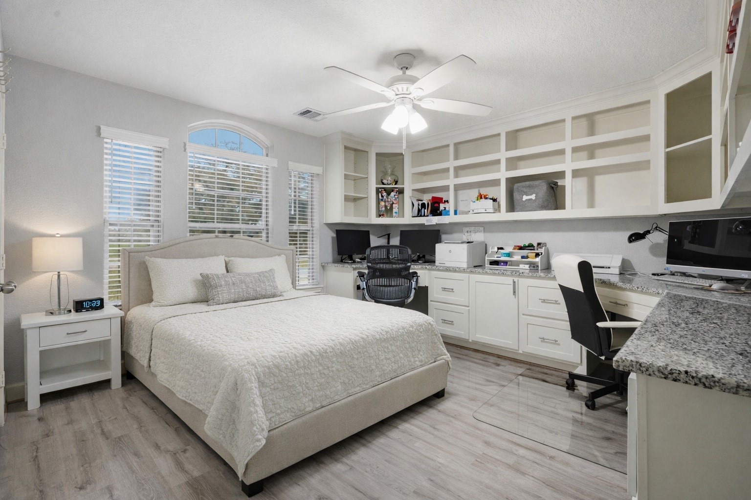 615 Lilley Road Alvin, TX 77511 - Photo 25 of 42 AI image showing queen-sized bed and side table placed in this secondary bedroom