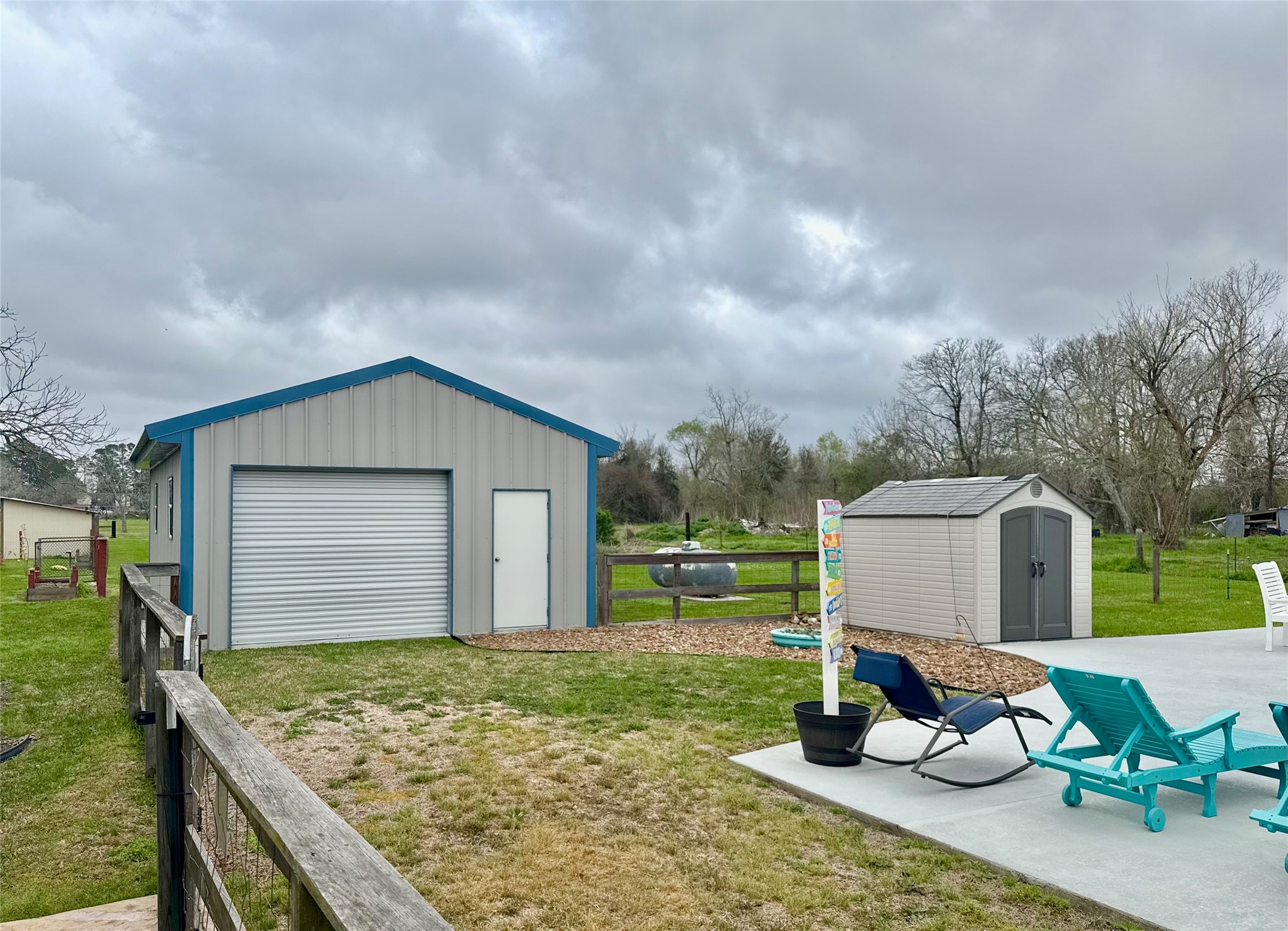 615 Lilley Road Alvin, TX 77511 - Photo 33 of 42 30' x 20' windstorm certified metal shop with two 8 x 10' roll-up doors, 4 double-pane windows, with electrical stubbed out.