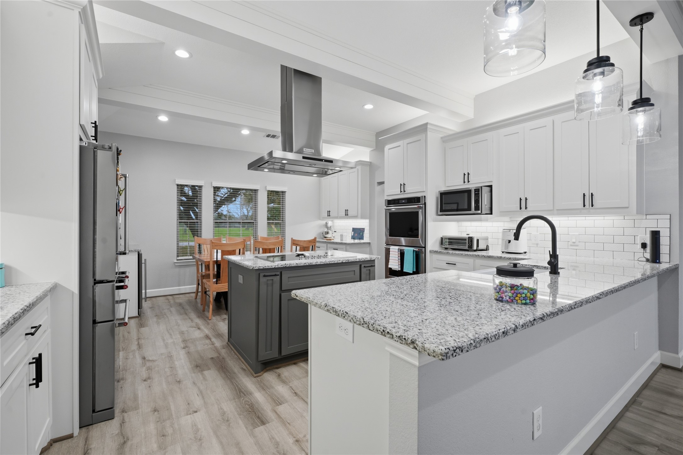 615 Lilley Road Alvin, TX 77511 - Photo 9 of 42 Additional kitchen updates include recessed lighting, island cooktop, and SS vent hood.