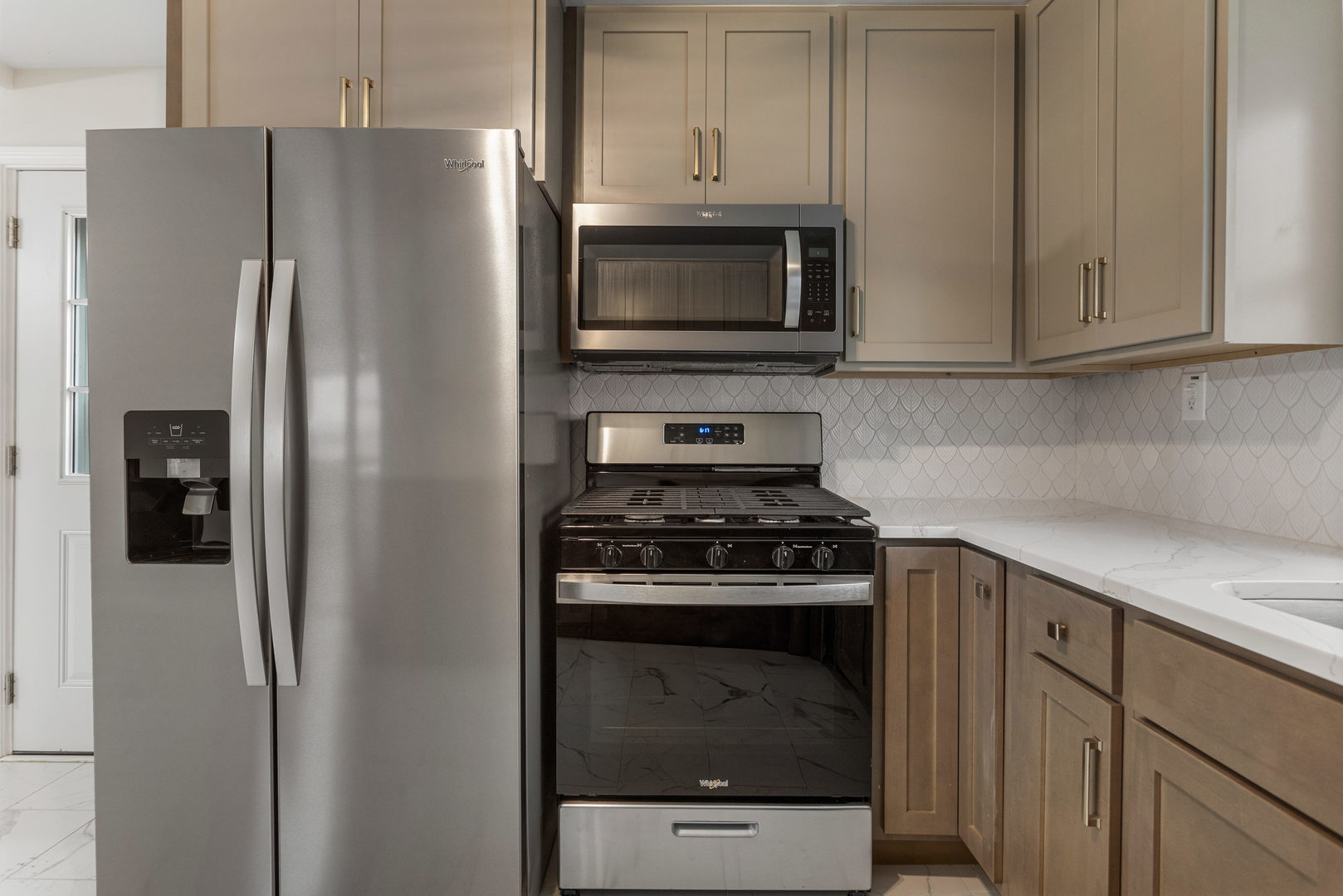 807 South Hamilton Street Monticello, IL 61856 - Photo 16 of 39 a kitchen with stainless steel appliances white cabinets and a stove