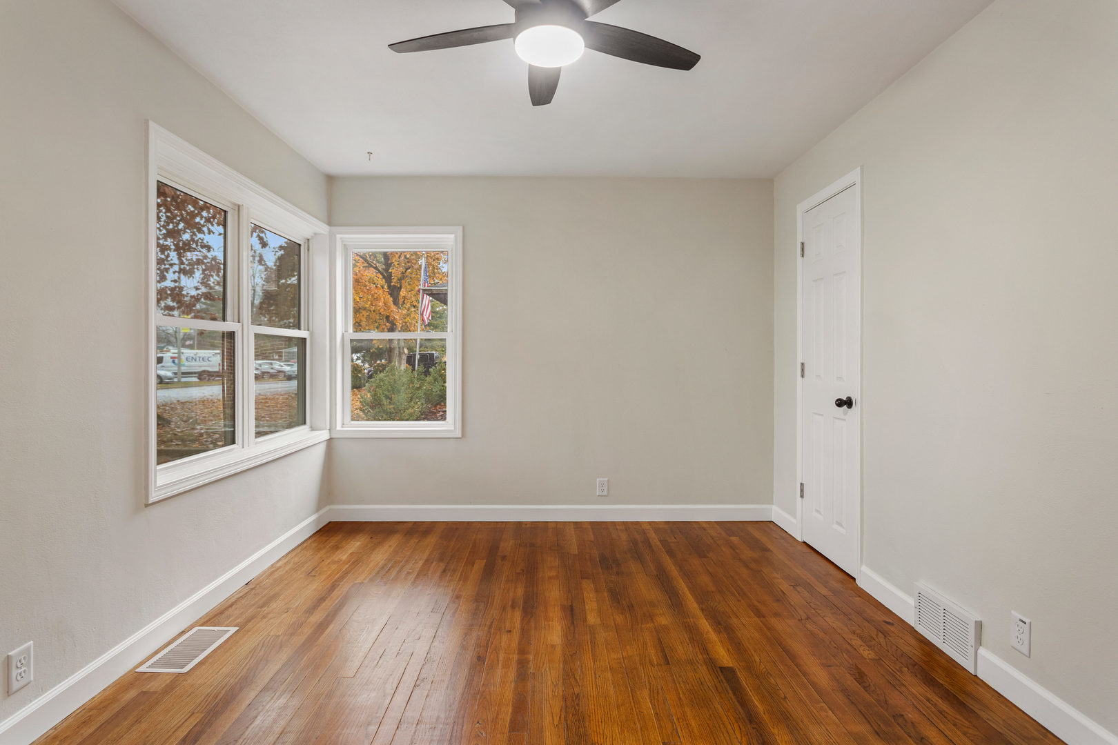 807 South Hamilton Street Monticello, IL 61856 - Photo 25 of 39 wooden floor in an empty room with a window