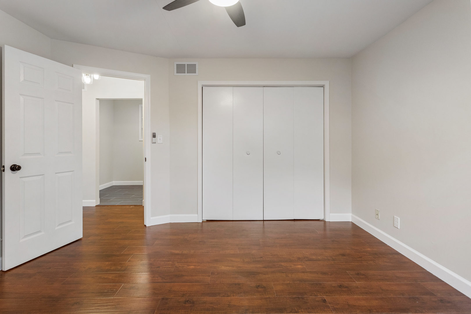 807 South Hamilton Street Monticello, IL 61856 - Photo 27 of 39 a view of an empty room with wooden floor