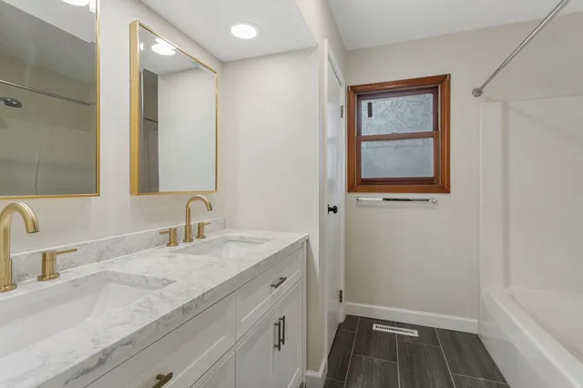 a bathroom with a sink and a mirror