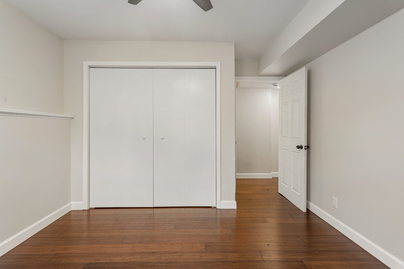 807 South Hamilton Street Monticello, IL 61856 - Photo 33 of 39 a view of an empty room with wooden floor and closet