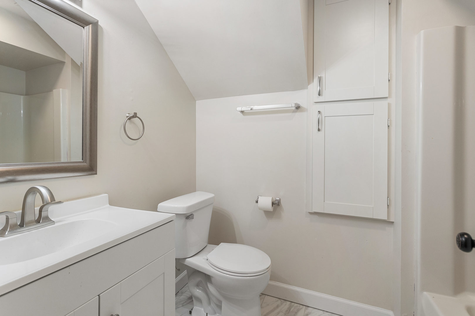 807 South Hamilton Street Monticello, IL 61856 - Photo 34 of 39 a bathroom with a sink a toilet and a mirror