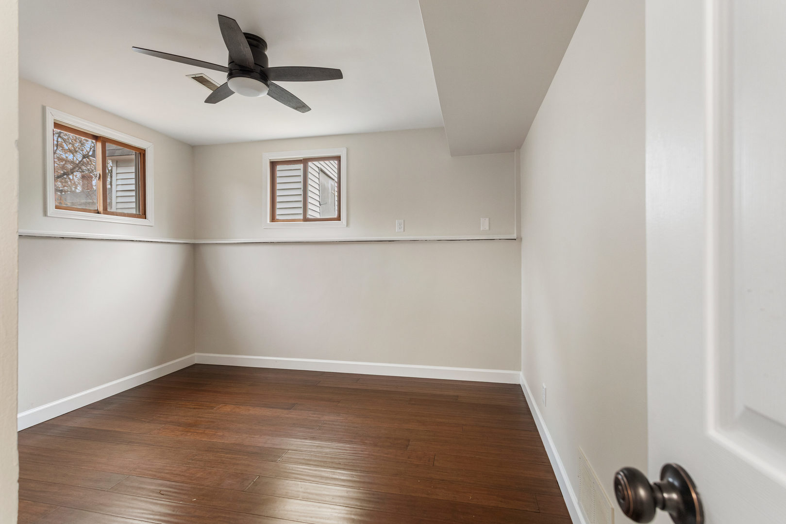 807 South Hamilton Street Monticello, IL 61856 - Photo 35 of 39 an empty room with wooden floor and windows