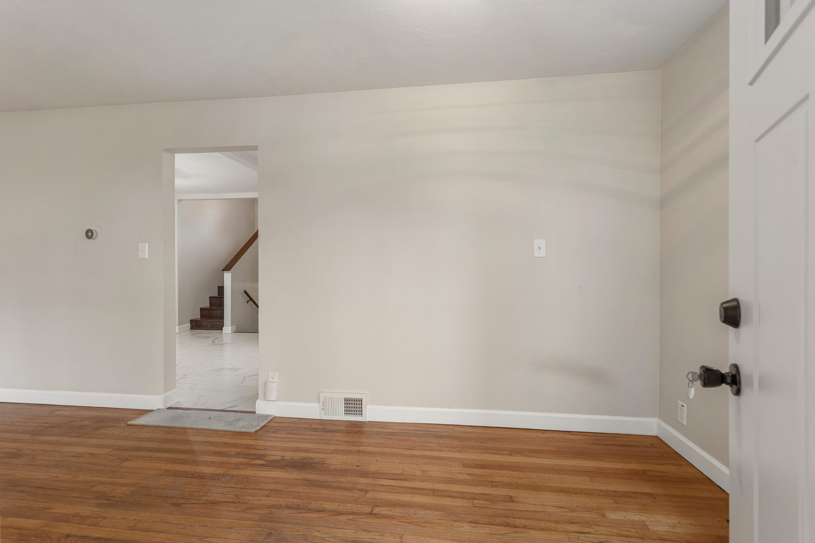 807 South Hamilton Street Monticello, IL 61856 - Photo 9 of 39 a view of a livingroom with wooden floor