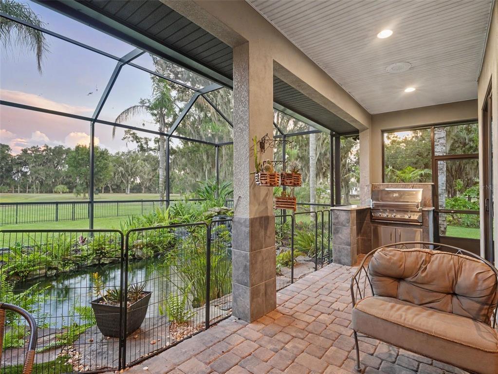 339 Corbett Road Lithia, FL 33547 - Photo 3 of 38 a balcony with couple of chairs and a couch