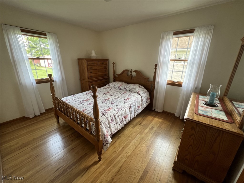 7579 McCreary Road Independence, OH 44131 - Photo 12 of 33 Bedroom with wood-type flooring