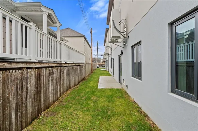 a view of a backyard with table and chairs