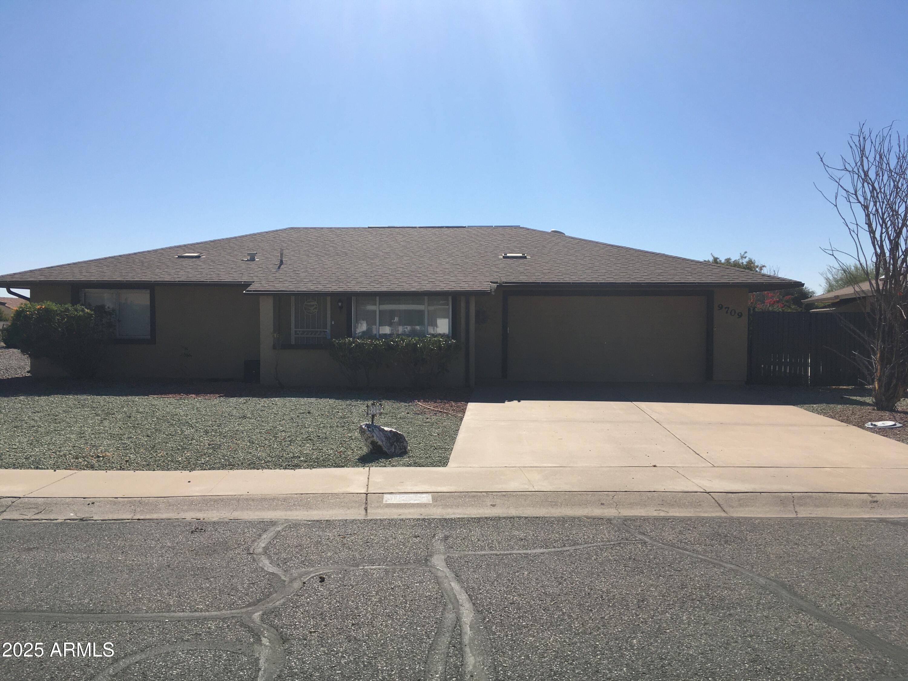 9709 West Rodeo Court Sun City, AZ 85373 - Photo 1 of 11 Rodeo Dr front elev