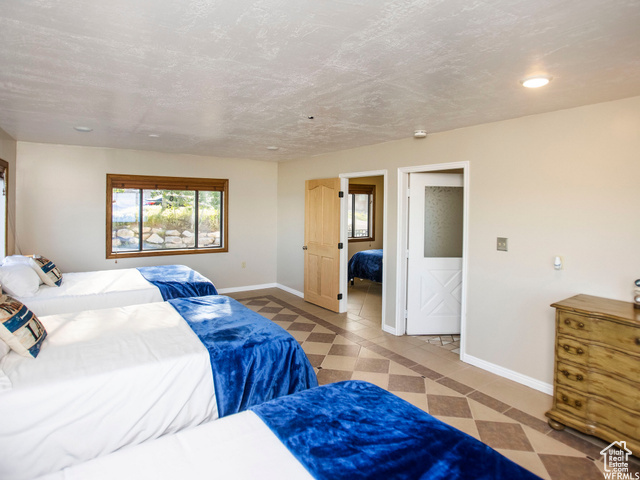 588 Raspberry Patch Road Garden City, UT 84028 - Photo 28 of 74 Bedroom with recessed lighting and a textured ceiling