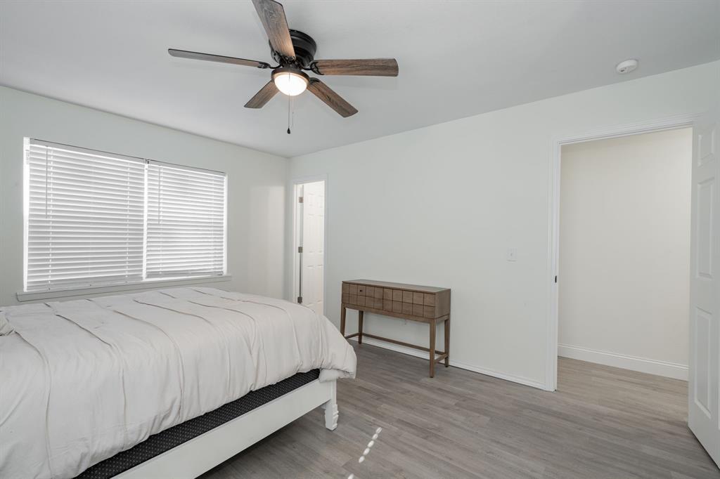 508 Rogers Way Rockwall, TX 75087 - Photo 19 of 25 a bedroom with a bed and a ceiling fan