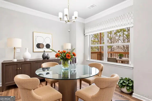 a dining room with furniture and window