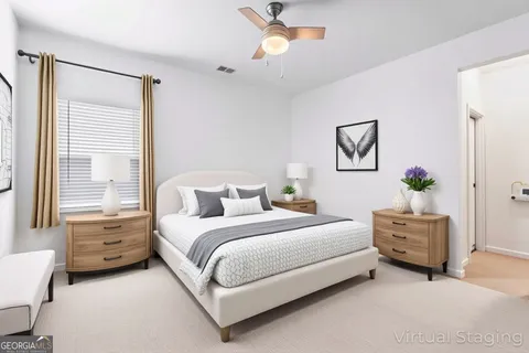 a bedroom with a bed dresser and a window
