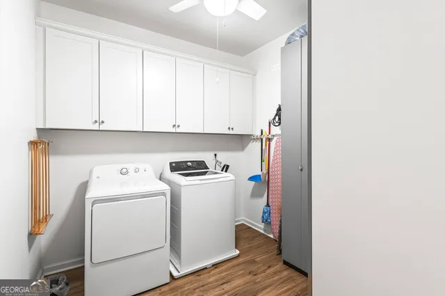 a view of a storage and utility room with washer and dryer