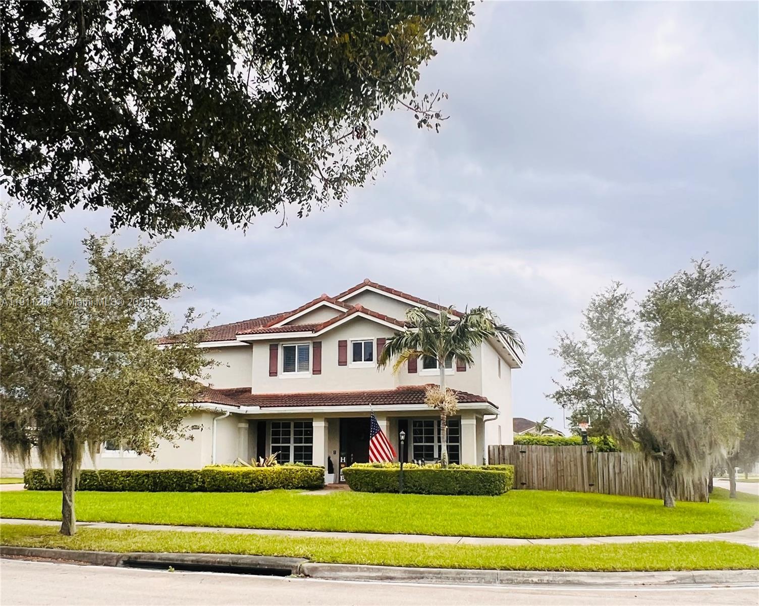 12780 Southwest 224th Street Miami, FL 33170 - Photo 1 of 29 a front view of a house with a garden