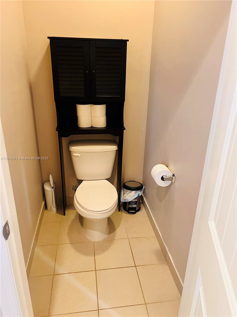 12780 Southwest 224th Street Miami, FL 33170 - Photo 14 of 29 a bathroom with a toilet and a sink