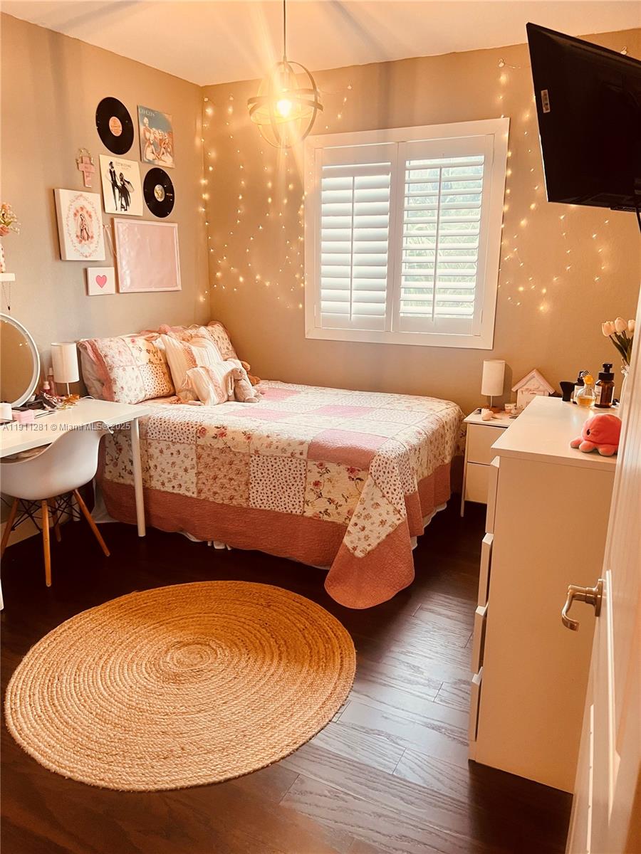 12780 Southwest 224th Street Miami, FL 33170 - Photo 16 of 29 a bed room with a bed and a table