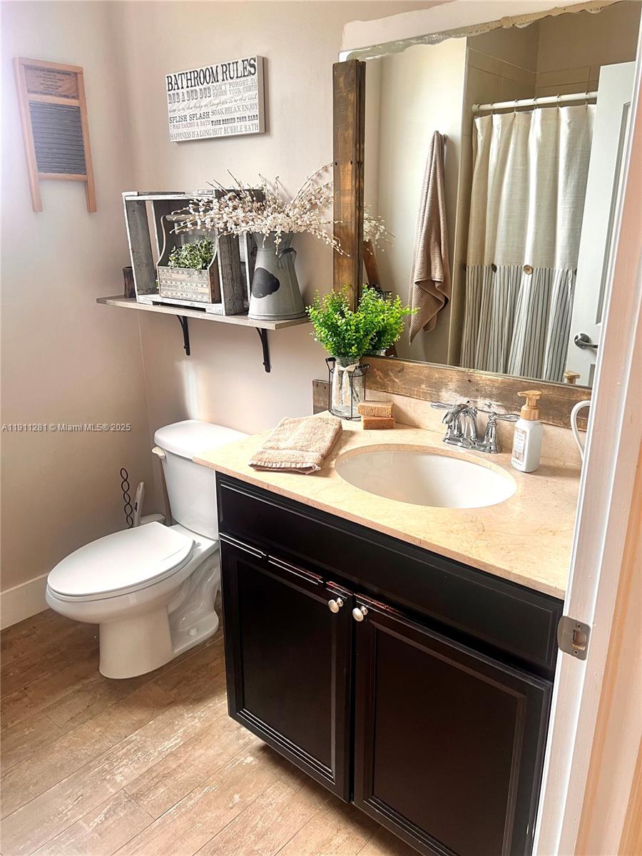 12780 Southwest 224th Street Miami, FL 33170 - Photo 23 of 29 a bathroom with a sink and a mirror