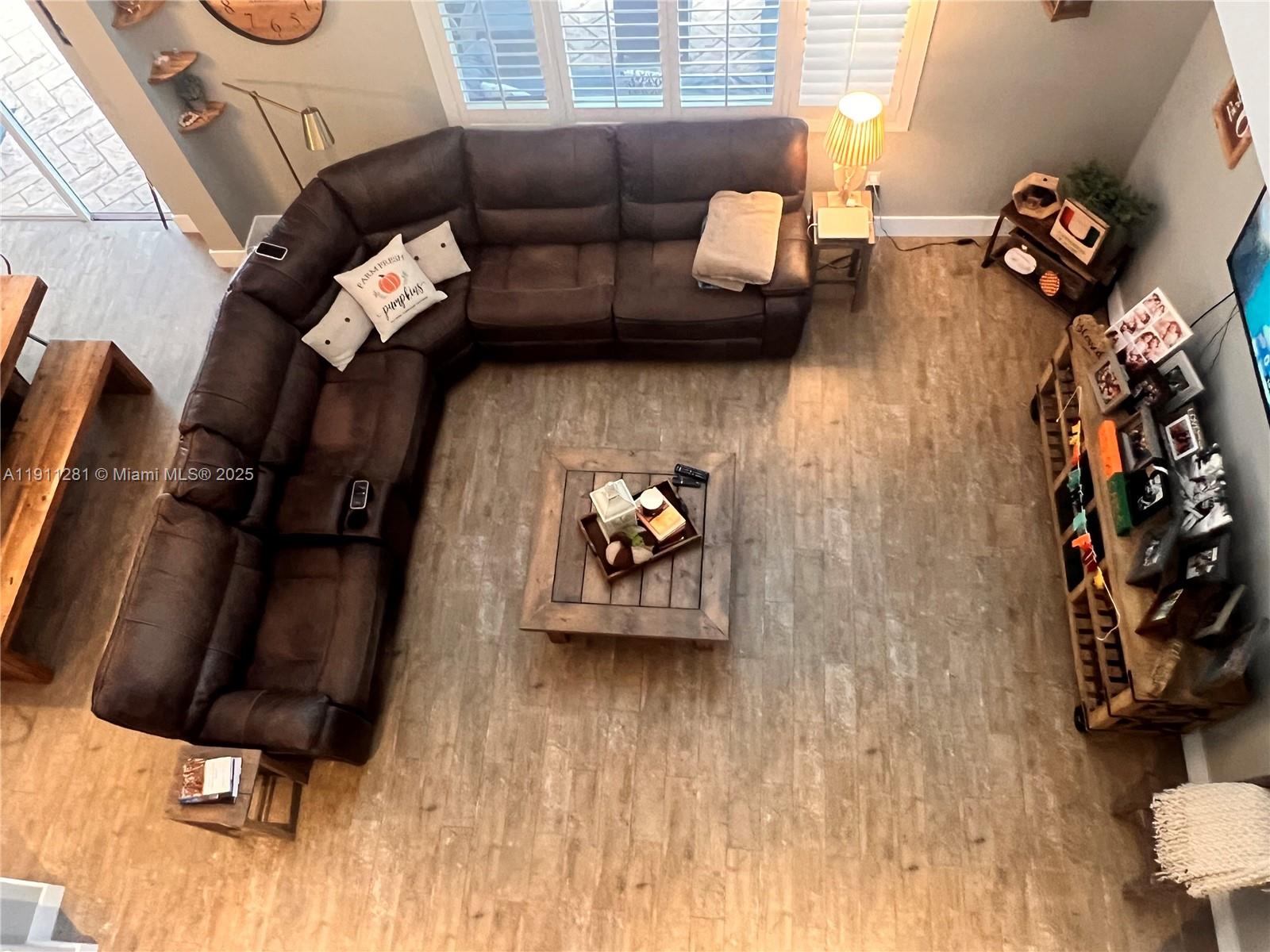 12780 Southwest 224th Street Miami, FL 33170 - Photo 24 of 29 a living room with furniture and wooden floor