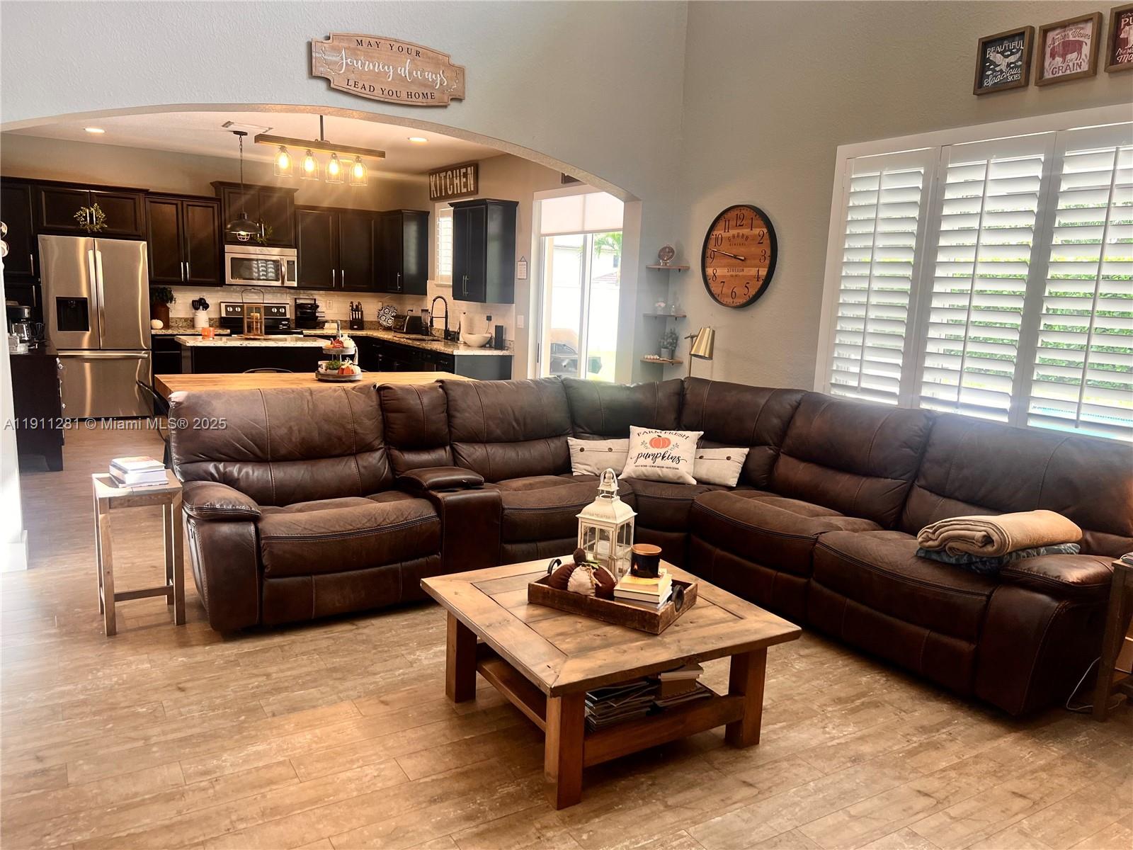 12780 Southwest 224th Street Miami, FL 33170 - Photo 8 of 29 a living room with furniture and a large window