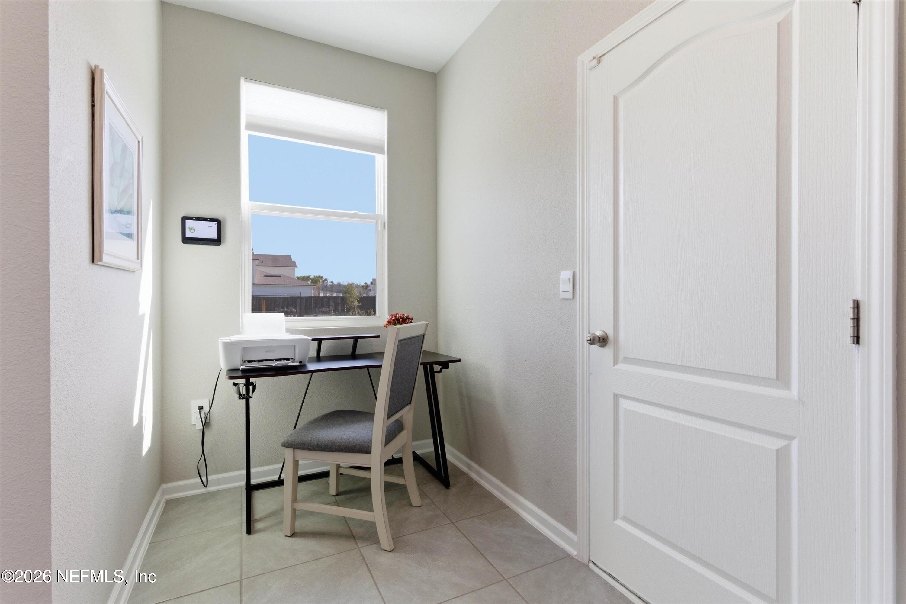 103 Seaport Breeze Road St. Augustine, FL 32095 - Photo 15 of 44 a dining room with furniture and window