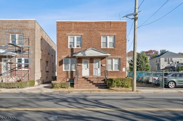 a front view of a building with street view