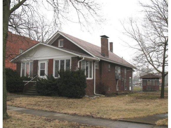 a front view of a house with yard