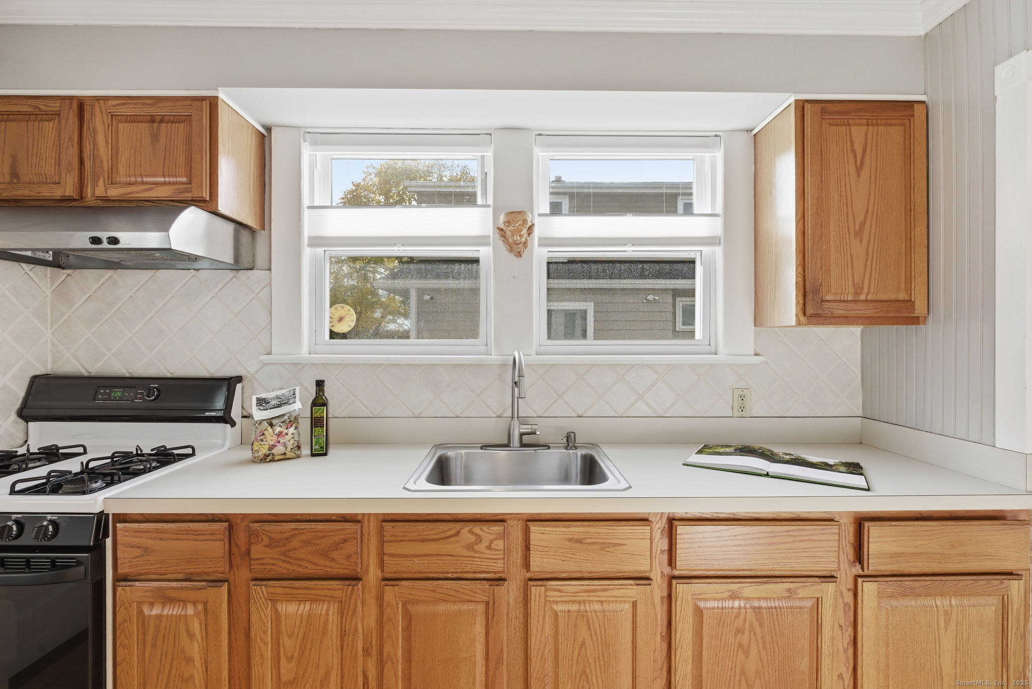 41 Sterling Place, Unit 1 Stamford, CT 06907 - Photo 11 of 29 a kitchen with stainless steel appliances granite countertop a sink and a white cabinets