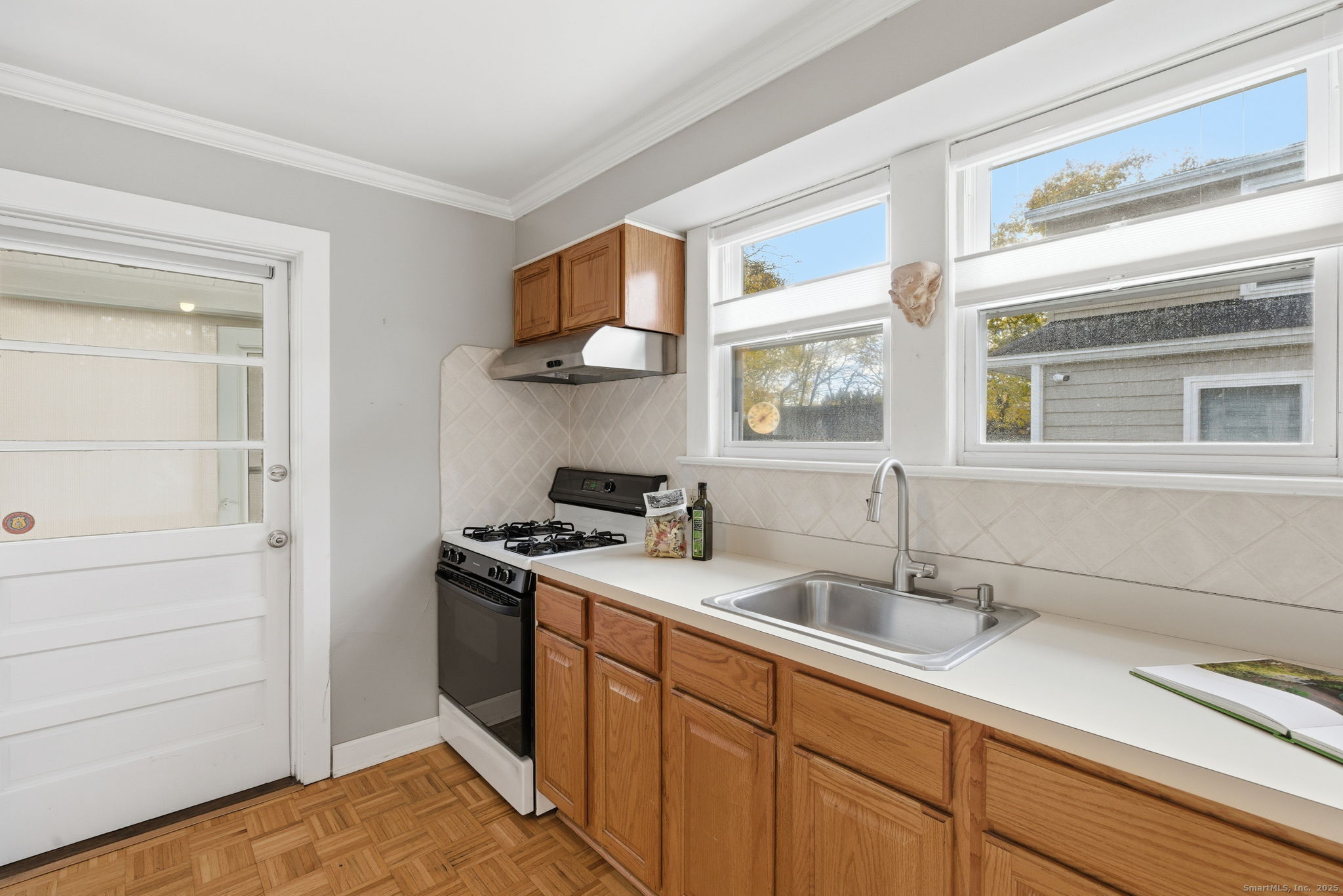 41 Sterling Place, Unit 1 Stamford, CT 06907 - Photo 13 of 29 a kitchen with stainless steel appliances granite countertop a sink and a stove next to a window