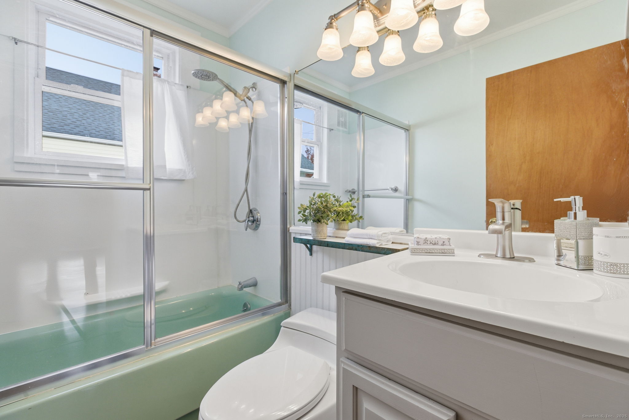 41 Sterling Place, Unit 1 Stamford, CT 06907 - Photo 19 of 29 a bathroom with a sink a toilet and a mirror