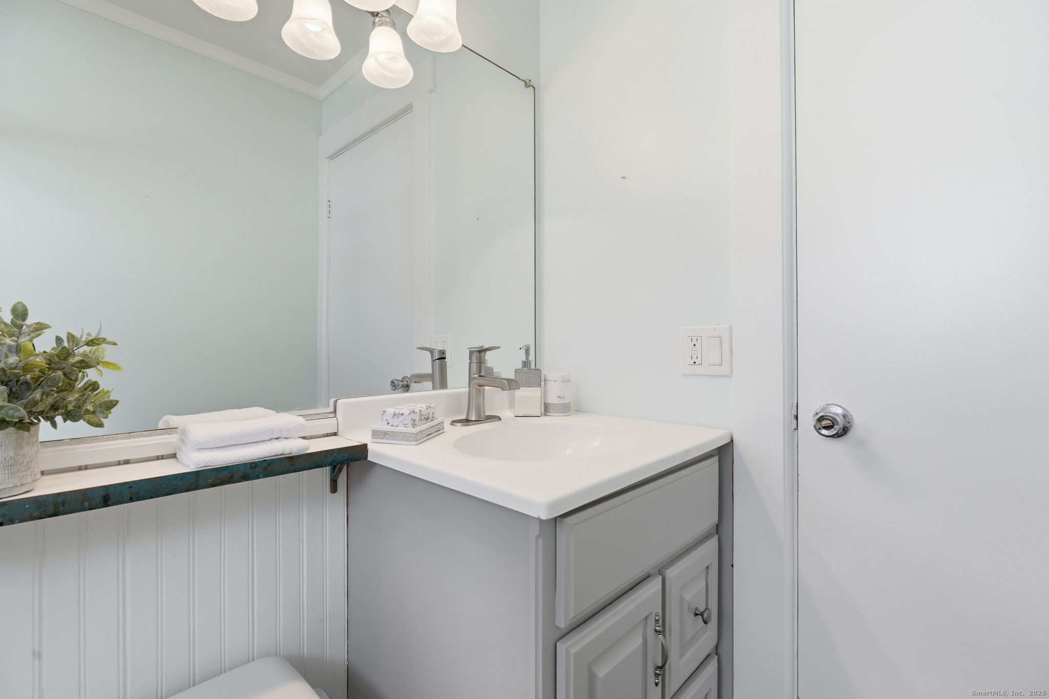 41 Sterling Place, Unit 1 Stamford, CT 06907 - Photo 20 of 29 a bathroom with a sink and a mirror