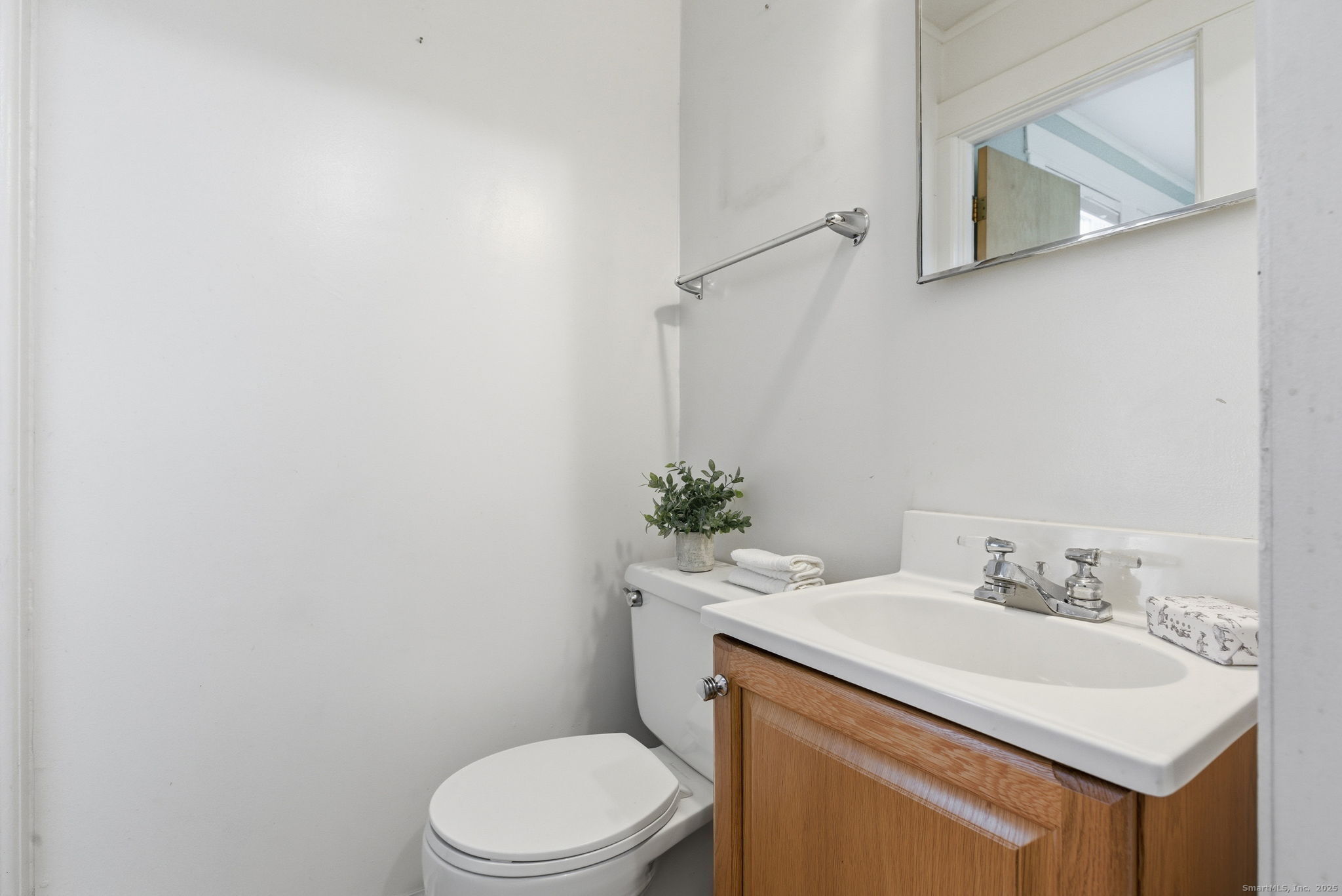 41 Sterling Place, Unit 1 Stamford, CT 06907 - Photo 23 of 29 a bathroom with a sink toilet and a mirror