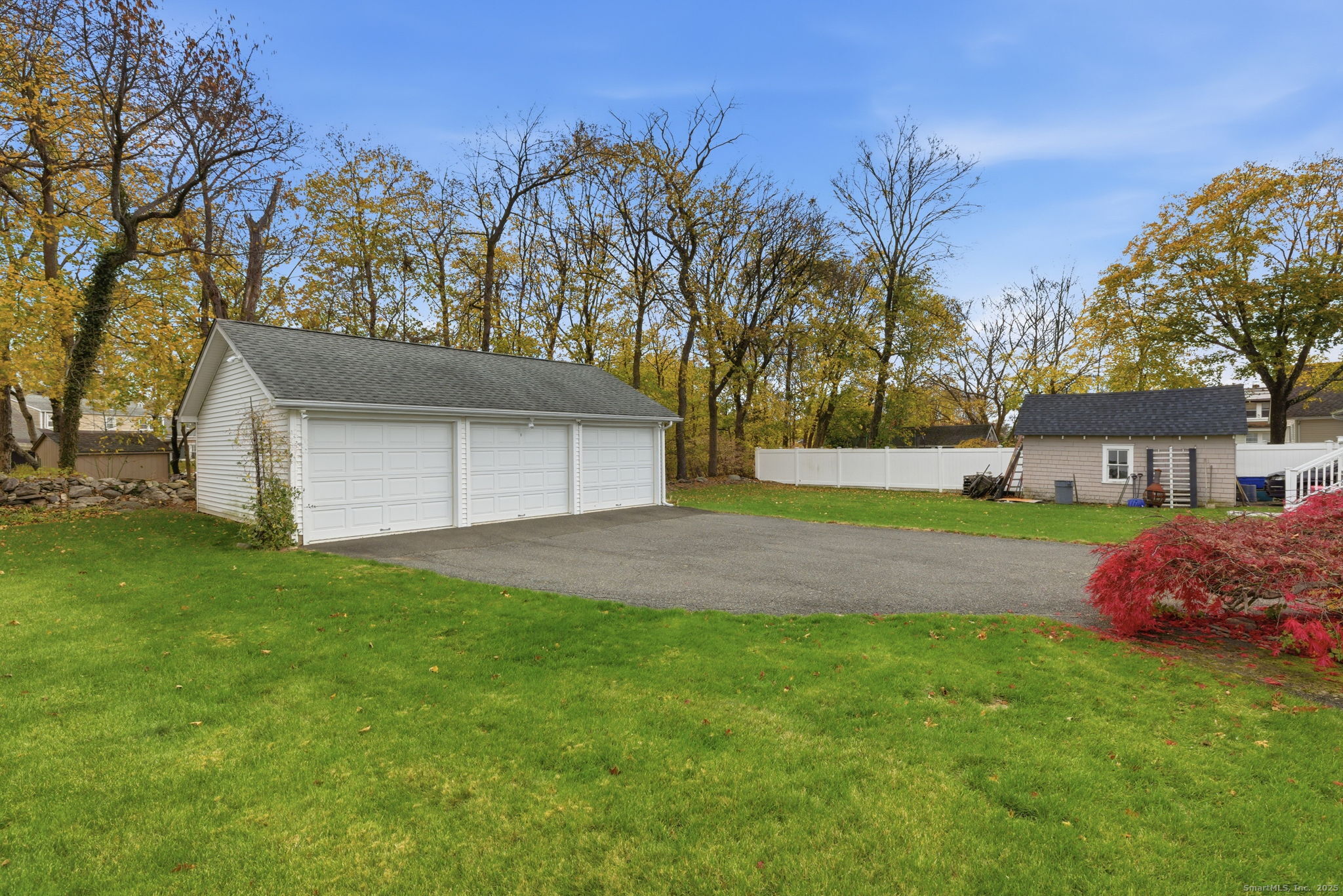 41 Sterling Place, Unit 1 Stamford, CT 06907 - Photo 26 of 29 a front view of a house with a yard and garage