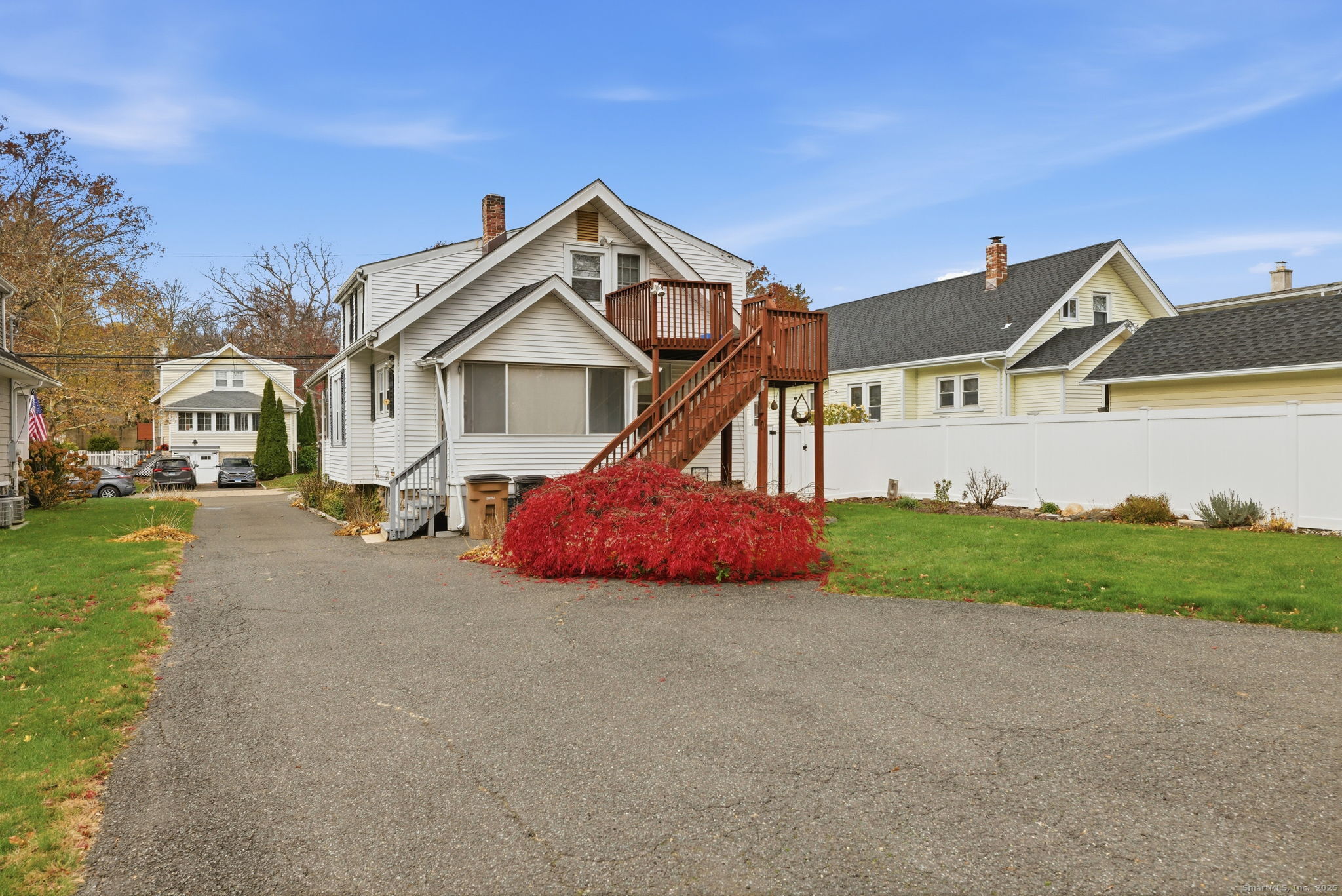 41 Sterling Place, Unit 1 Stamford, CT 06907 - Photo 27 of 29 a front view of a house with a yard and garage
